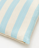 light blue striped throw pillow with white stitching, gold zipper & removable pillow insert