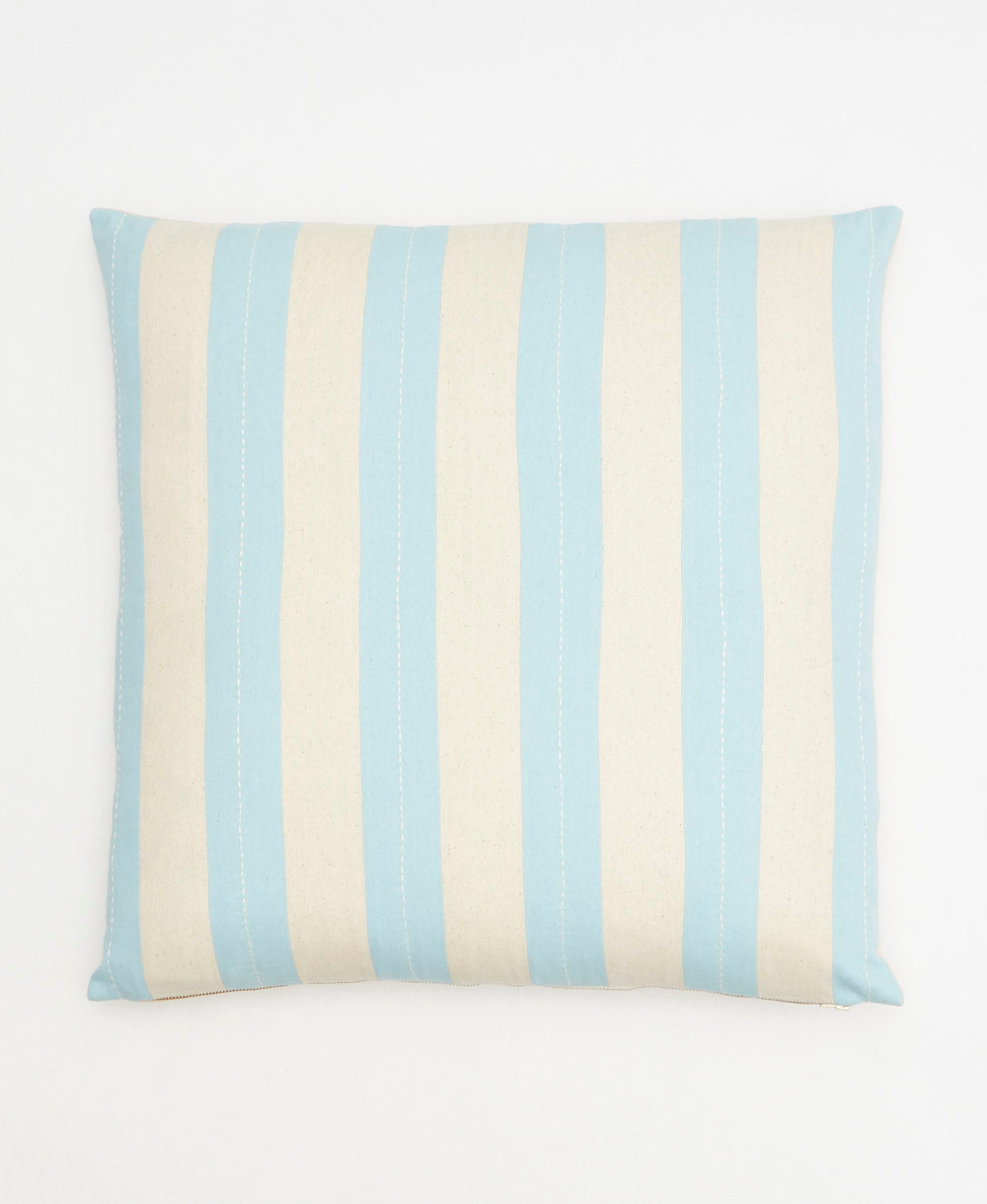 light blue striped throw pillow adorned with white simple line stitching by Anchal