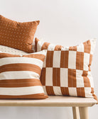 checkered accent pillow in camel brown with other camel striped & cross-stitch pillows by Anchal