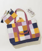 colorful checkered tote bag in purple and yellow with matching pouches