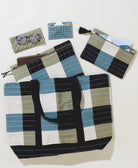 large canvas tote bag in blue and green checkered pattern with matching small pouches