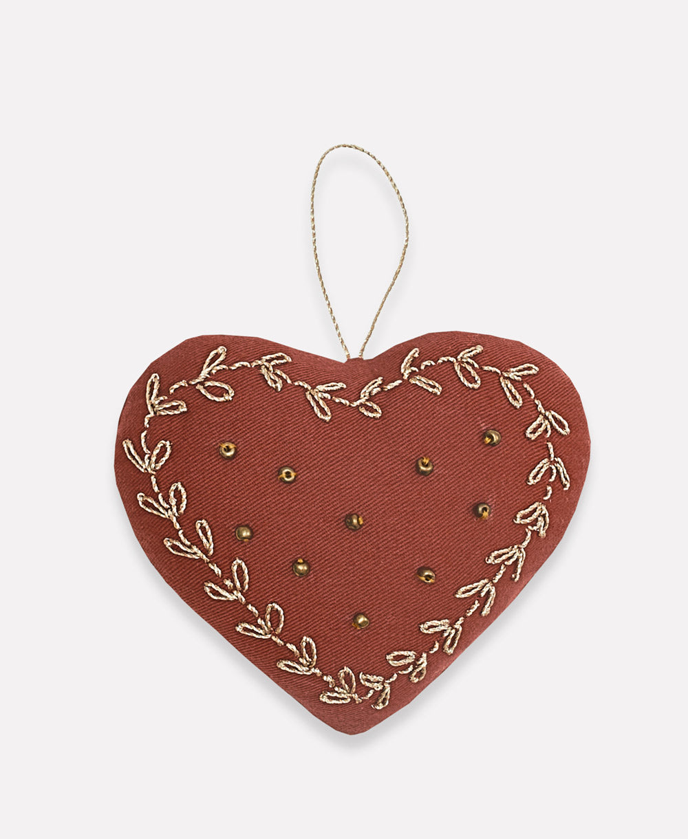 ethically made rust red heart ornament with gold stitching and gold beading handmade in India