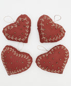 group of rust red handmade heart ornaments with gold stitching and gold beads