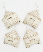 group of white and gold house-shaped fabric ornaments handmade from organic cotton in India by women artisans