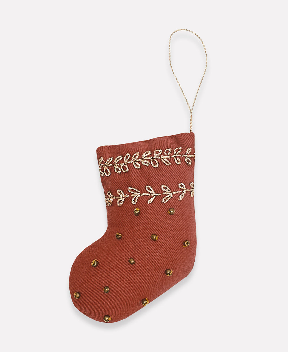 handmade ornament in a rust stocking shape with gold embroidery & beads handmade in India