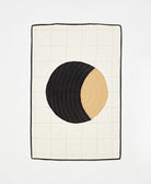 Small crib quilt featuring lunar hand-stitched pattern made with organic cotton