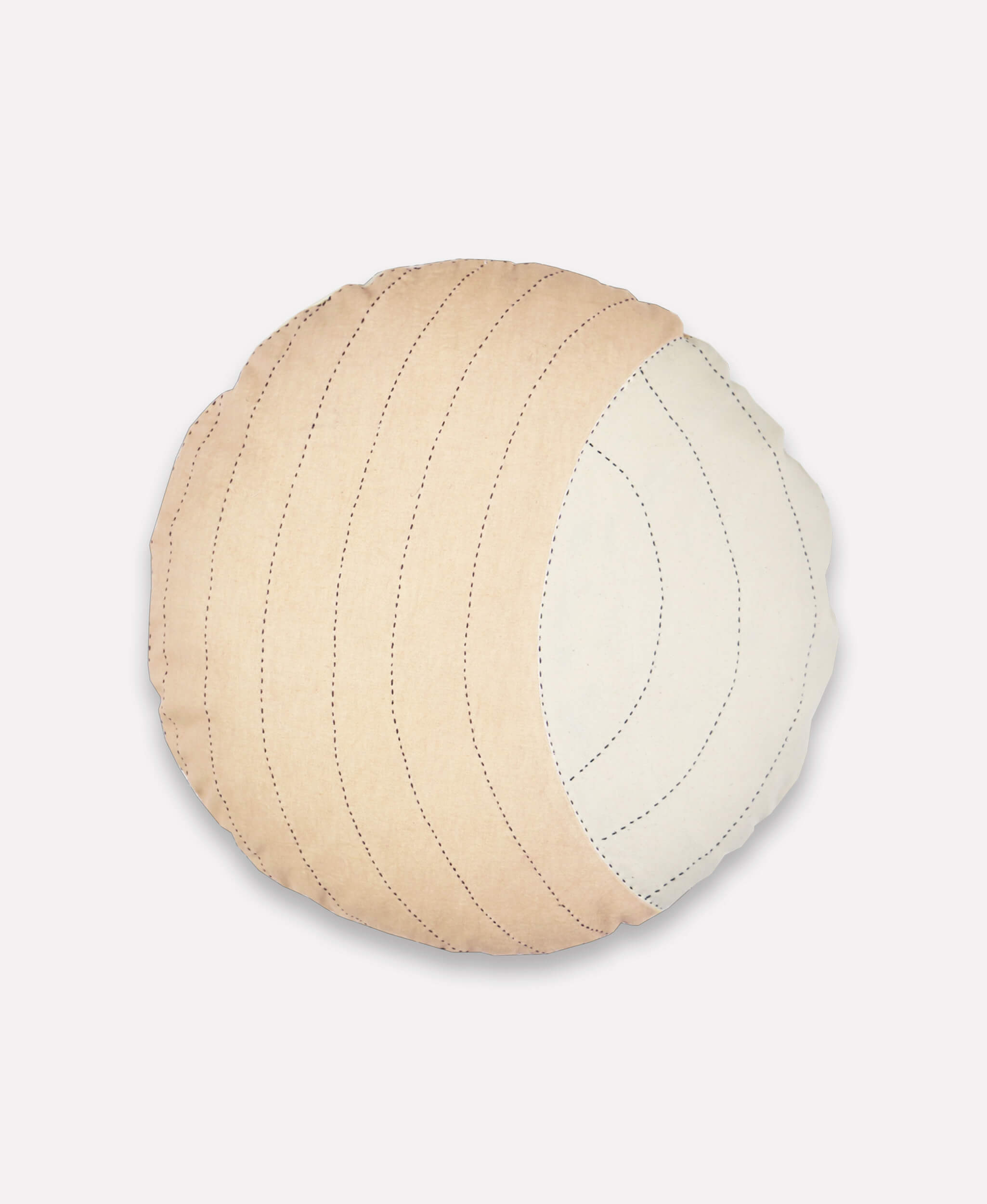 Round quilted pillow with beige and white color scheme on a light gray background