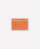Small pouch with star pattern and gold zipper on a white background