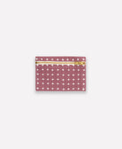 purple pouch with white cross pattern and gold zipper on a white background