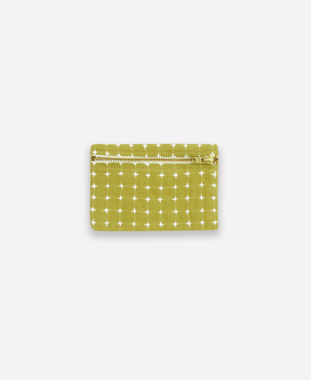 green coin purse with white cross-stitch pattern handmade in India