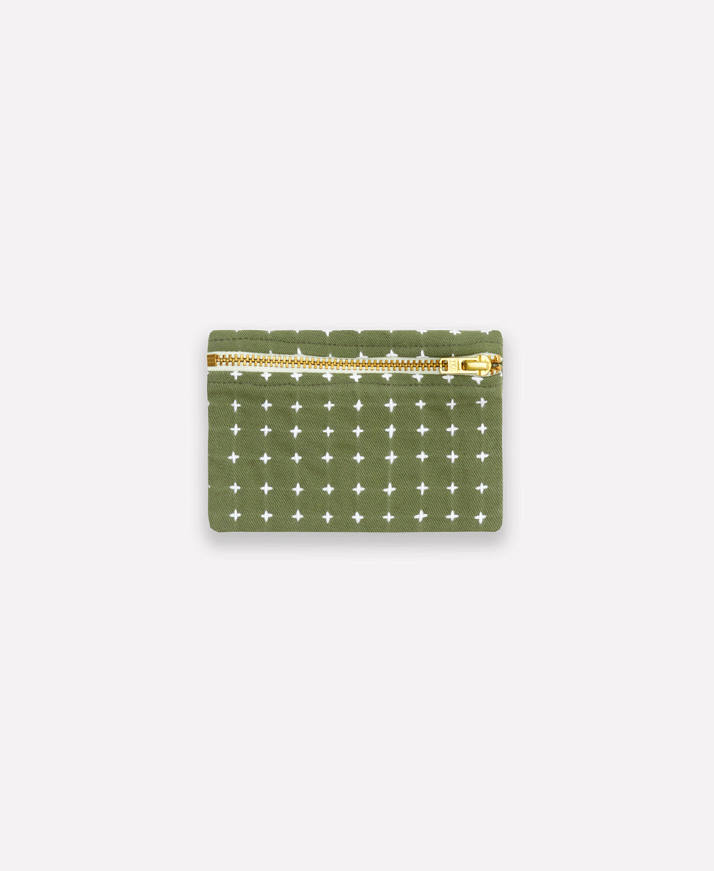 Green wallet with gold zipper on a white background