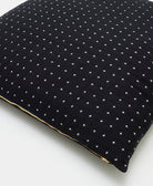 gold zipper closure on cross-stitch euro sham in black handcrafted by women artisans