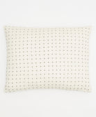 off-white bedding pillow sham with tiny black cross-stitches handmade in India