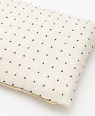 small pillow 12 x 16 in natural white twill with black hand-stitched modern cross-stitch pattern