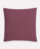 back of berry purple cross-stitch throw pillow in solid