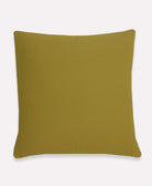 solid green back of cross-stitch throw pillow