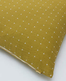 moss green with white cross-stitch pattern with gold tone zipper closure