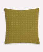 moss green throw pillow with white cross-stitch embroidery pattern