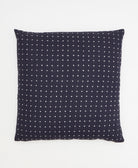 navy blue throw pillow with tiny white cross-stitch embroidery on front handmade in India