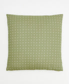 sage green throw pillow with white embroidered tiny cross-stitch pattern on front