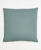 back of spruce green cross-stitch throw pillow made by women artisans in Fair Trade environment