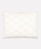 hand-embroidered white decorative pillow sham with diamond pattern