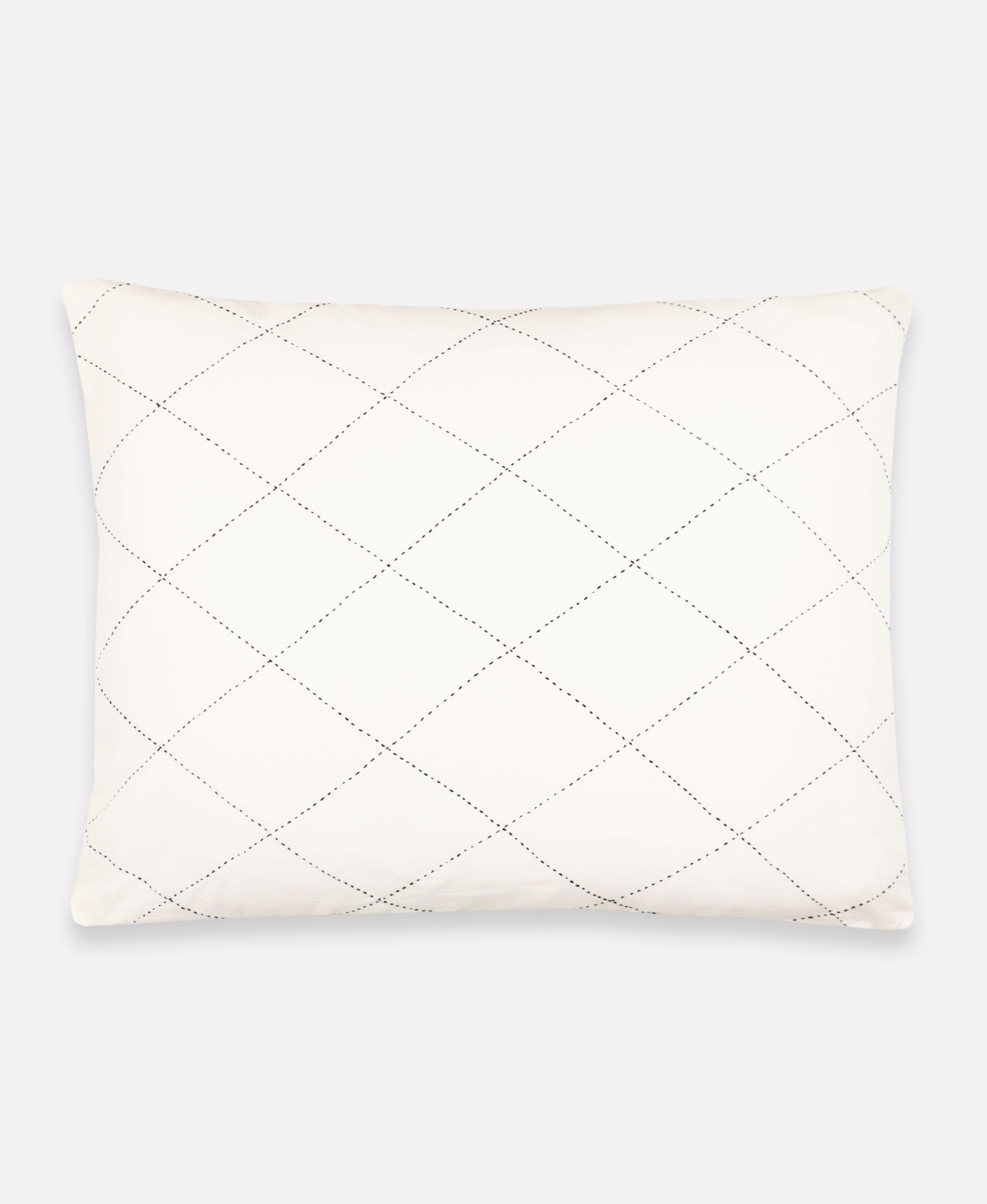 hand-embroidered white decorative pillow sham with diamond pattern