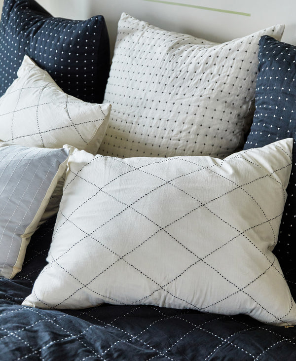 black and white hand-embroidered standard pillow sham in diamond pattern