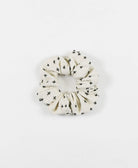 embroidered scrunchie in bone ivory with black embroidery made from 100% organic cotton