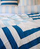 quilted organic cotton throw in cobalt blue and sky blue