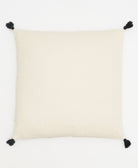 natural white back of geometric stitch throw pillow with black cotton tassels on each corner