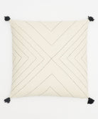 geometric stitch throw pillow with black embroidery and tassels