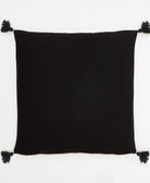 black square throw pillow made from 100% organic cotton with black tassels on each corner