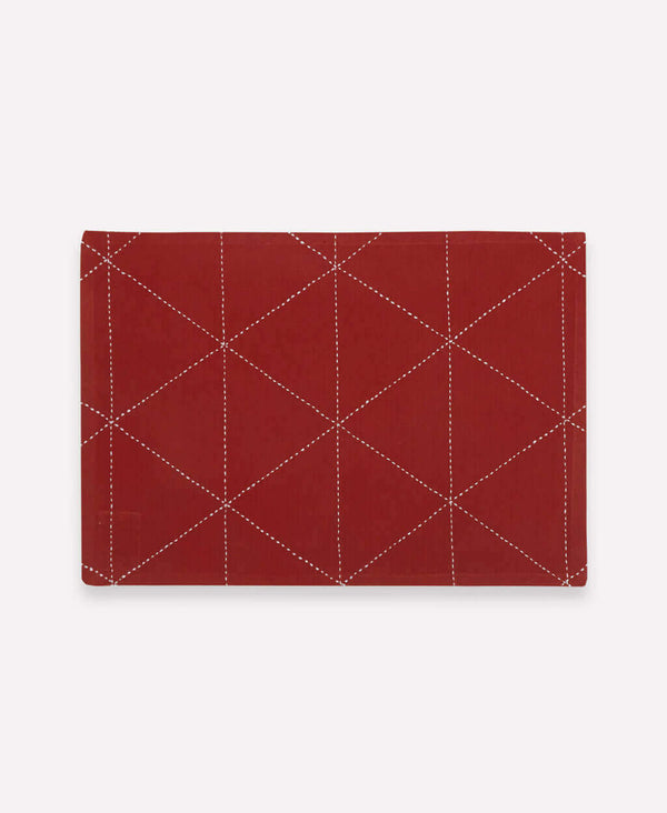 rust cloth placemat set with geometric embroidery by Anchal Project