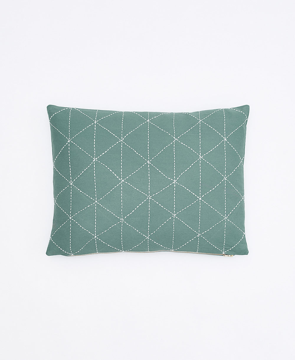 spruce green small pillow with white triangle embroidery