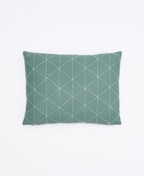 spruce green pillow with diamond pattern on a white background