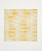 ethically handmade block print cotton napkin in mustard yellow and natural white striped floral