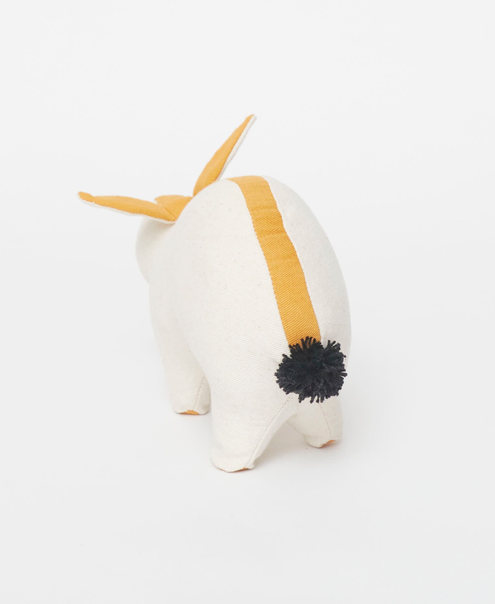 bunny stuffed animal with pom pom tail handmade by artisans in India from organic cotton