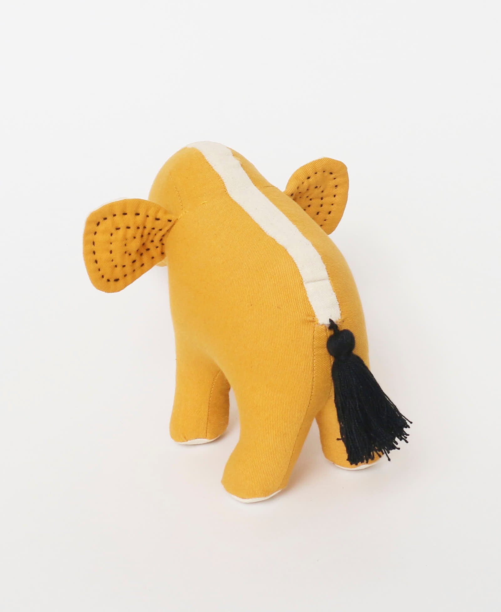 mustard yellow stuffed elephant with black handmade tassel tail by Anchal