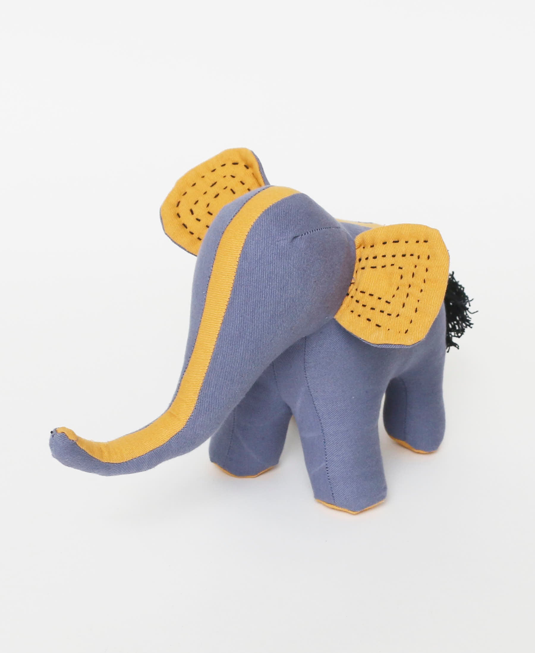 slate blue stuffed elephant with kantha emrboidered ears and long yellow trunk