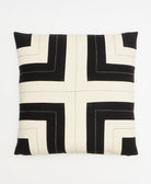 black and white throw pillow with hand-stitched embroidery forming a modern graphic pattern