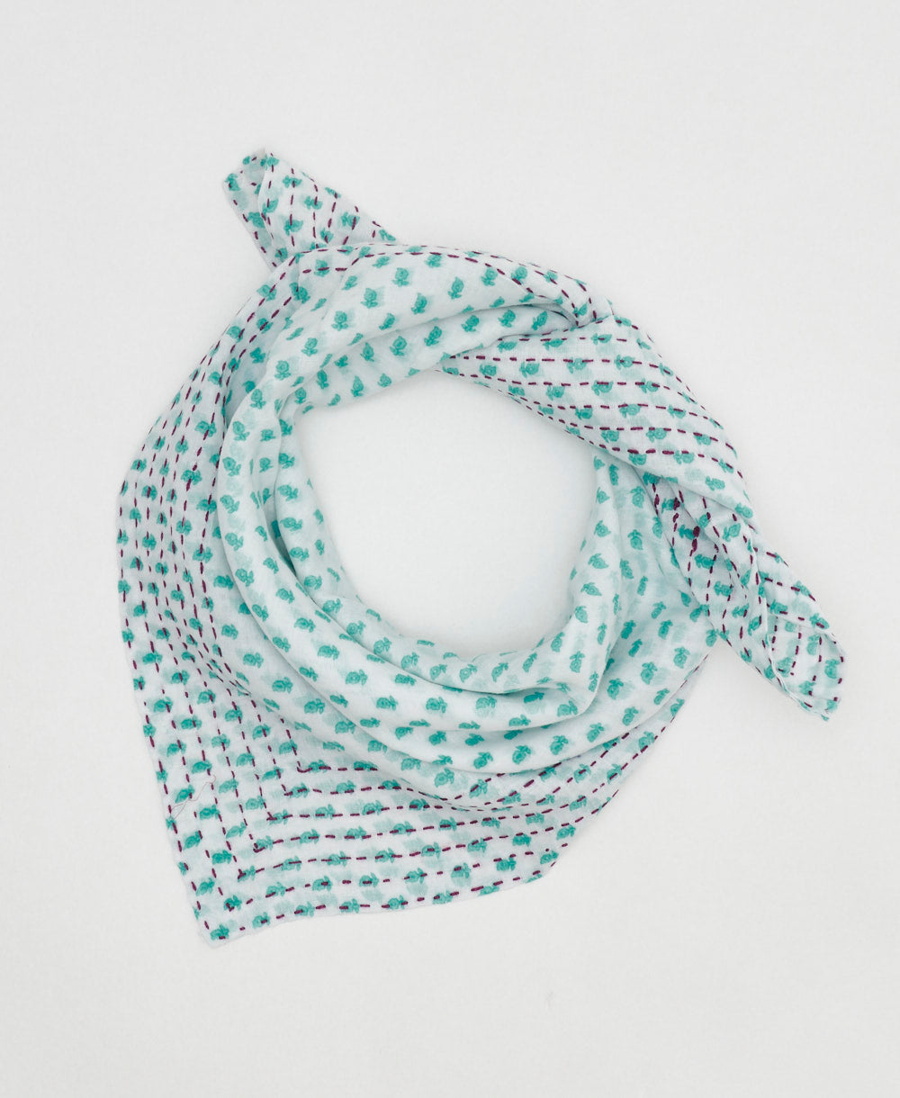 artisan-made vintage cotton bandana in a turquoise and white stamp floral 
