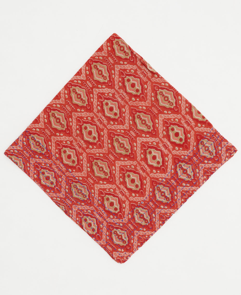 persimmon cotton bandana with a pink diamond print and hand-embroidered edges