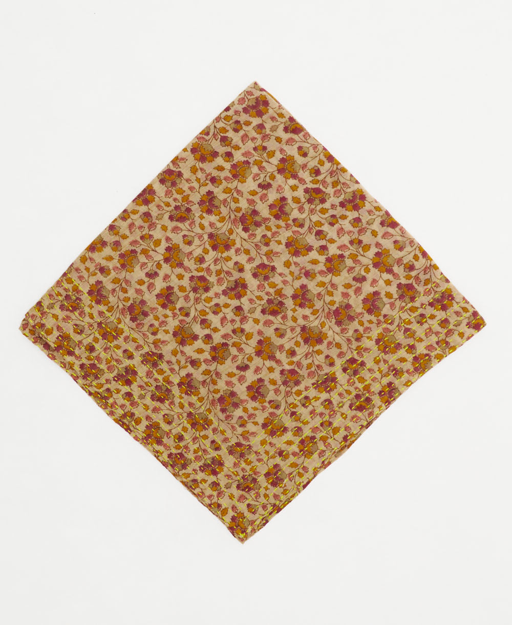 beige bandana with fall-colored floral print and embroidered edges