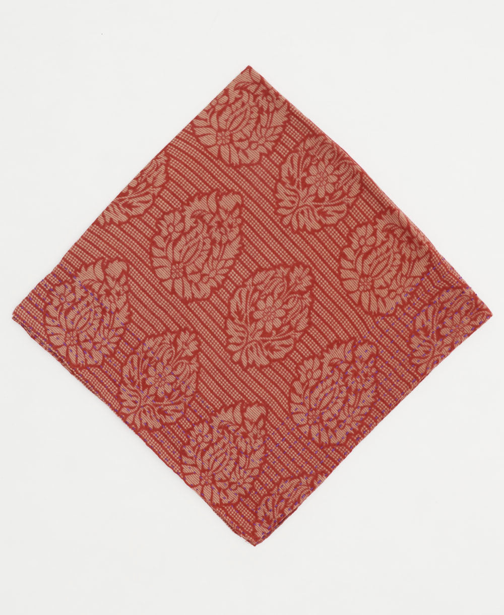 muted red medallion cotton bandana with bold embroidery along edge