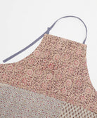 sustainable adjustable apron in mauve pink floral print made from one-of-a-kind saris with blue embroidery