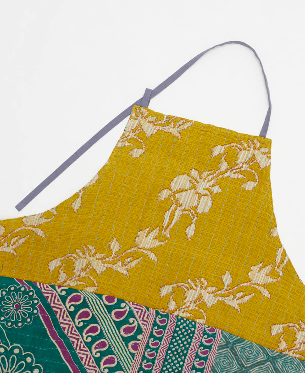 sustainable adjustable apron in yellow & green floral print made from one-of-a-kind saris with blue embroidery