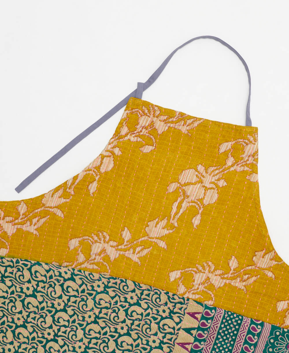 sustainable adjustable apron in yellow & emerald floral print made from one-of-a-kind saris with pink embroidery