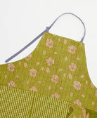 sustainable adjustable apron in pear green floral print made from one-of-a-kind saris with black embroidery