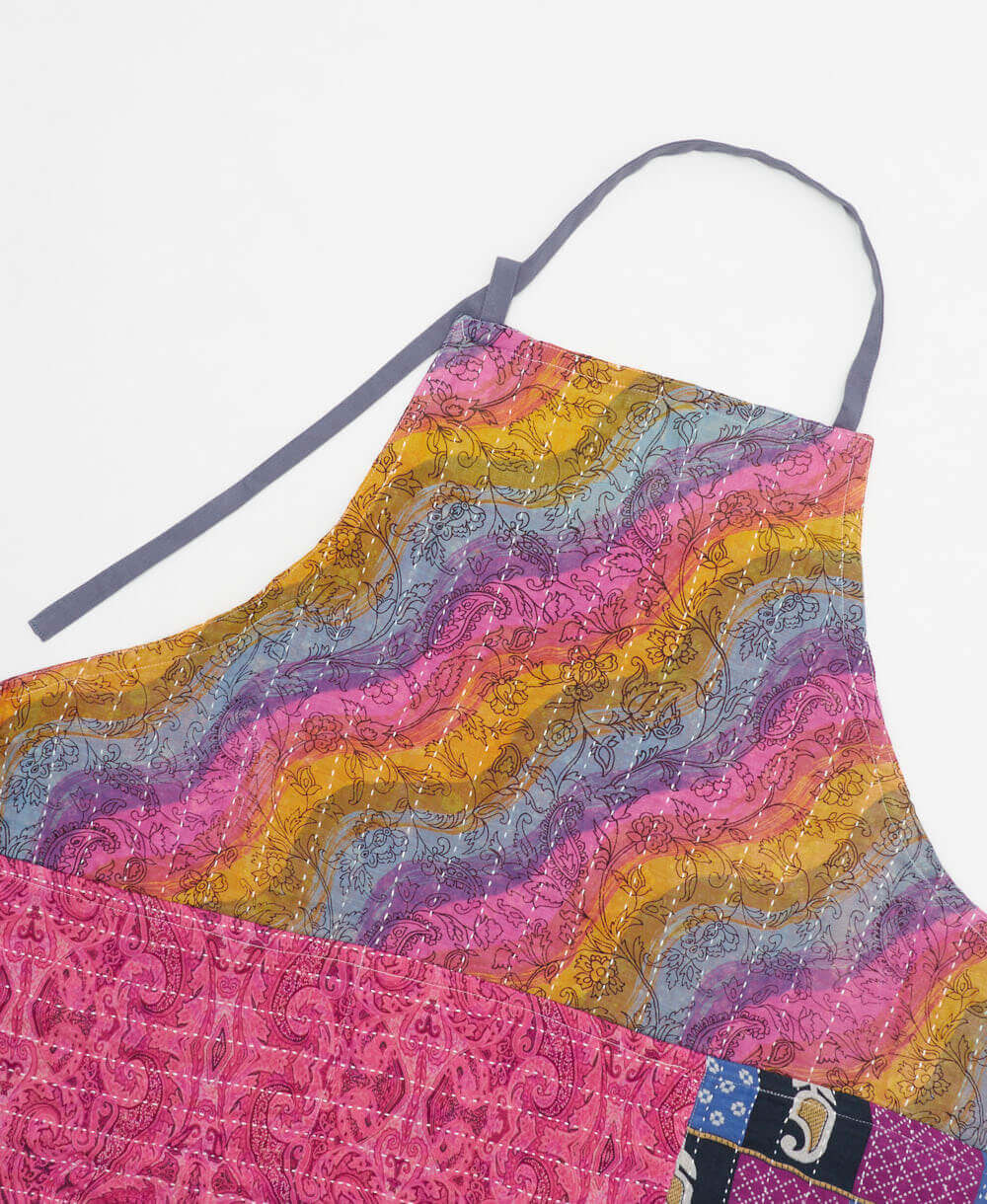 sustainable adjustable apron in pink rainbow wavy print made from one-of-a-kind saris with white embroidery